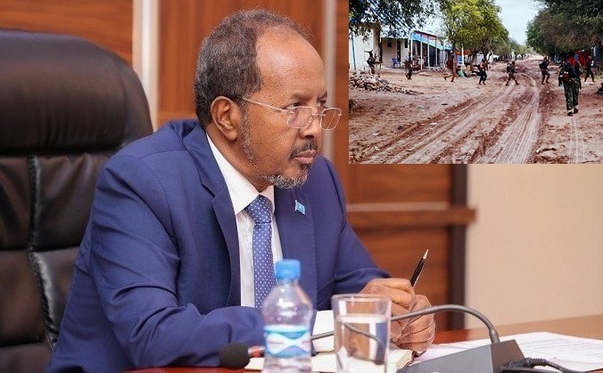 Madaxweyne Xasan oo wax qorsheynaya.jpg